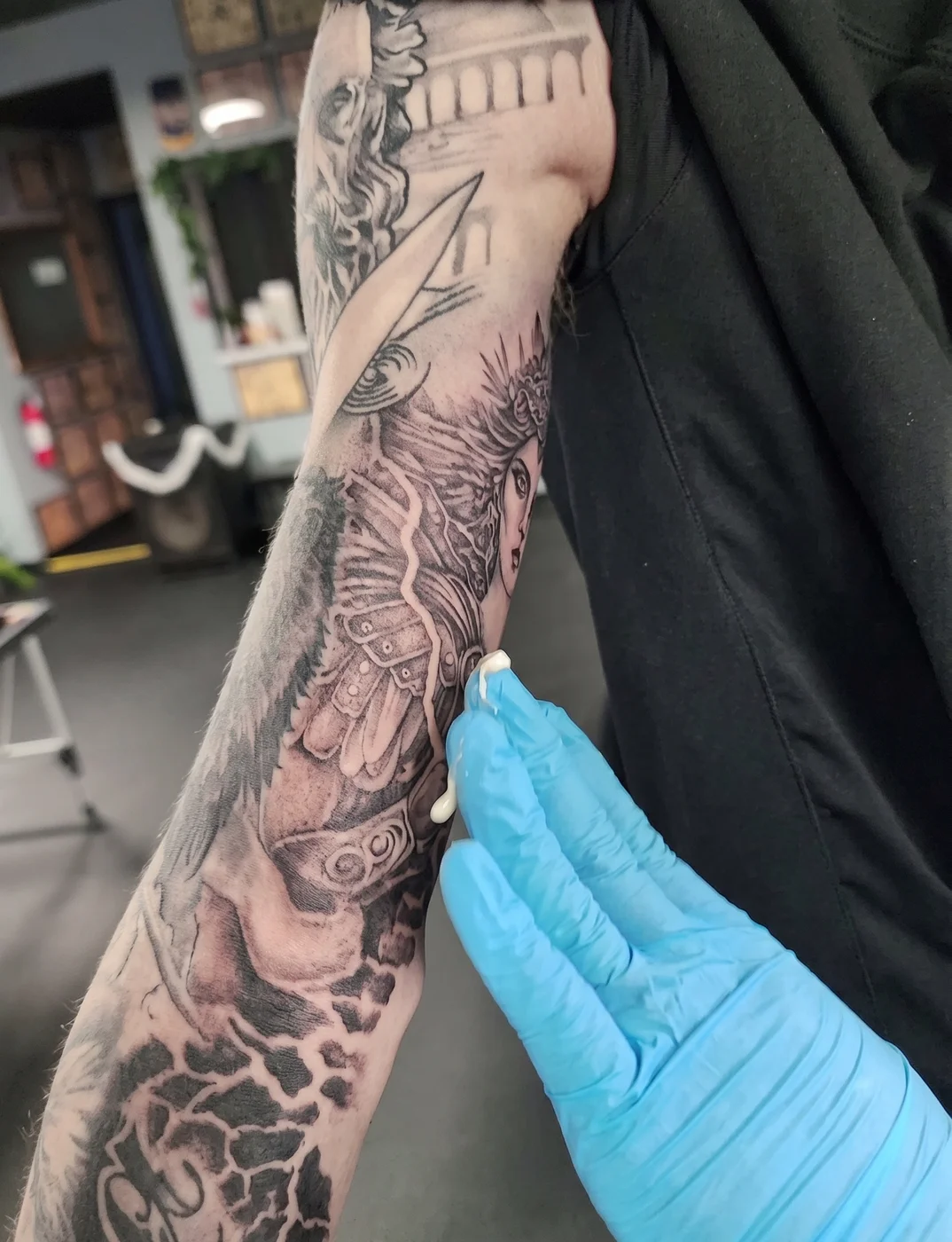 Tattoo Luv tin next to a fresh tattoo